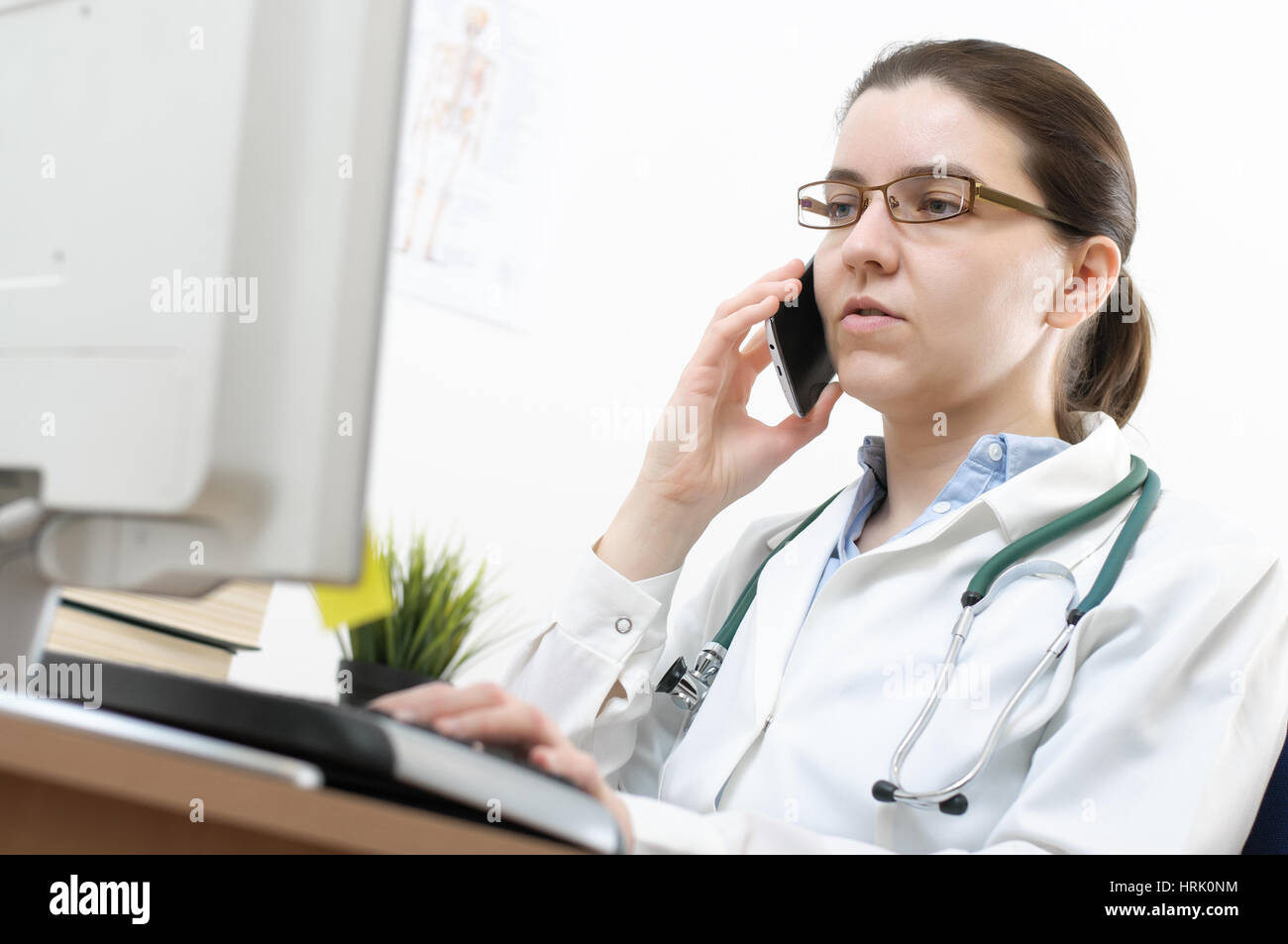 Female doctor talking woman desk hi-res stock photography and images ...