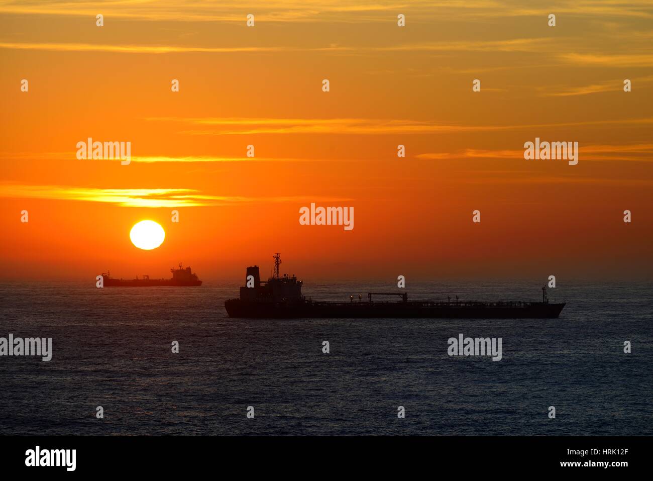 Cargo ships lying on roadstead at sunrise, Rio de Janeiro, Brazil Stock Photo