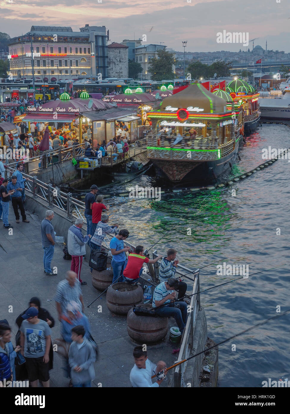 FLOATING FISH IN BREAD BOAT IN FRONT OF SULEYMANIYE MOSQUE  GALATA BRIDGE GOLDEN HORN ISTANBUL TURKEY Stock Photo