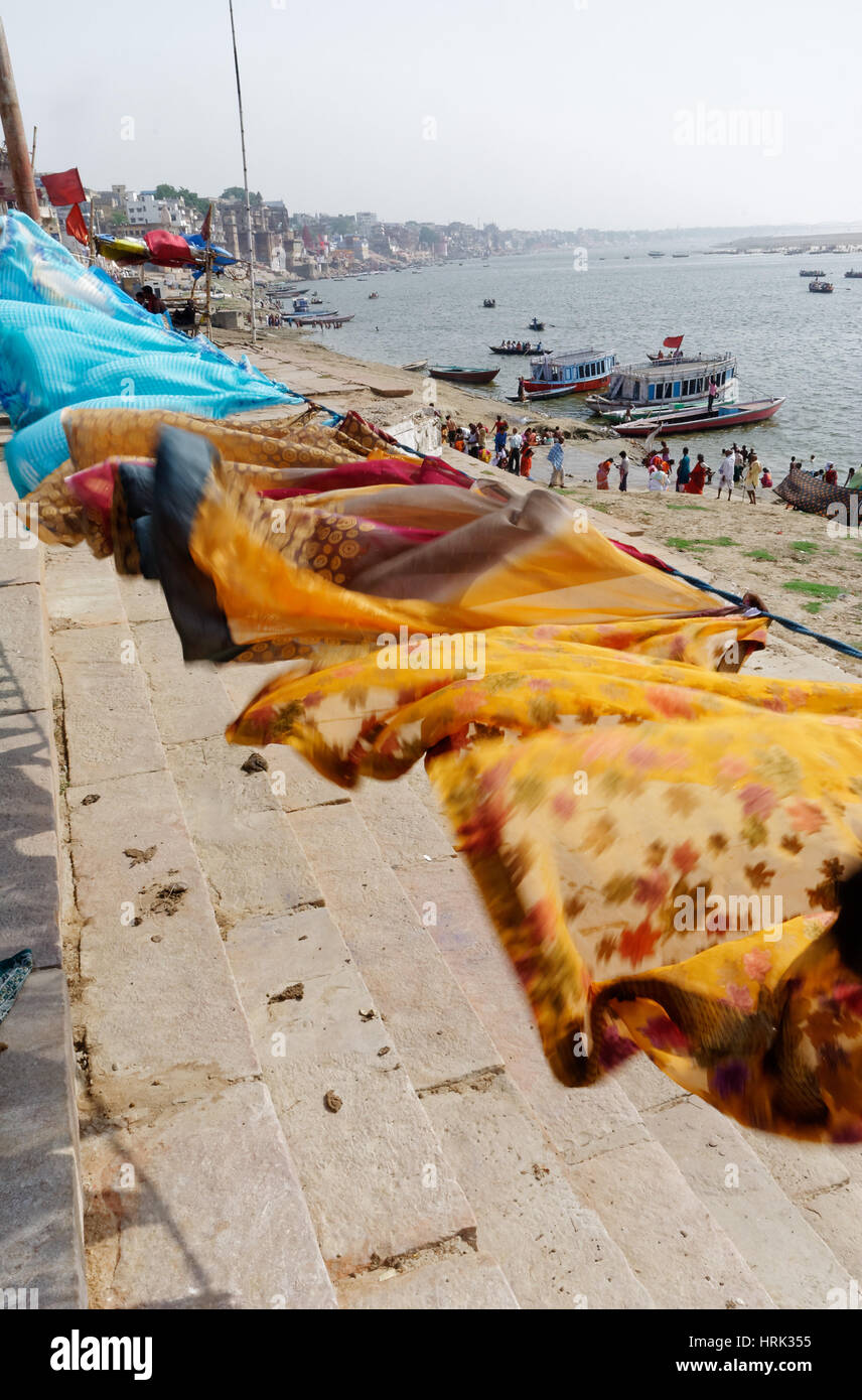Washing drying on the ghats on the banks of the Ganges at Varanasi in India Stock Photo