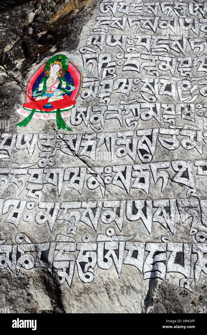 Prayers carved into square stones made into Mani Walls in the Khumbu region of Nepal Stock Photo