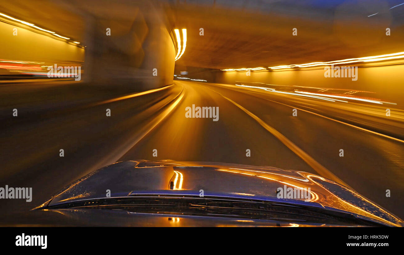 car driving through road tunnel leeds yorkshire united kingdom Stock