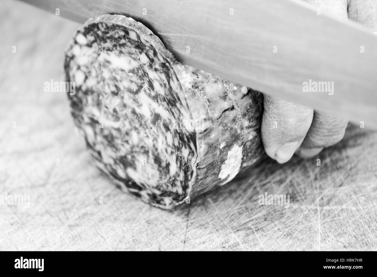 Slicing salami Stock Photo Alamy