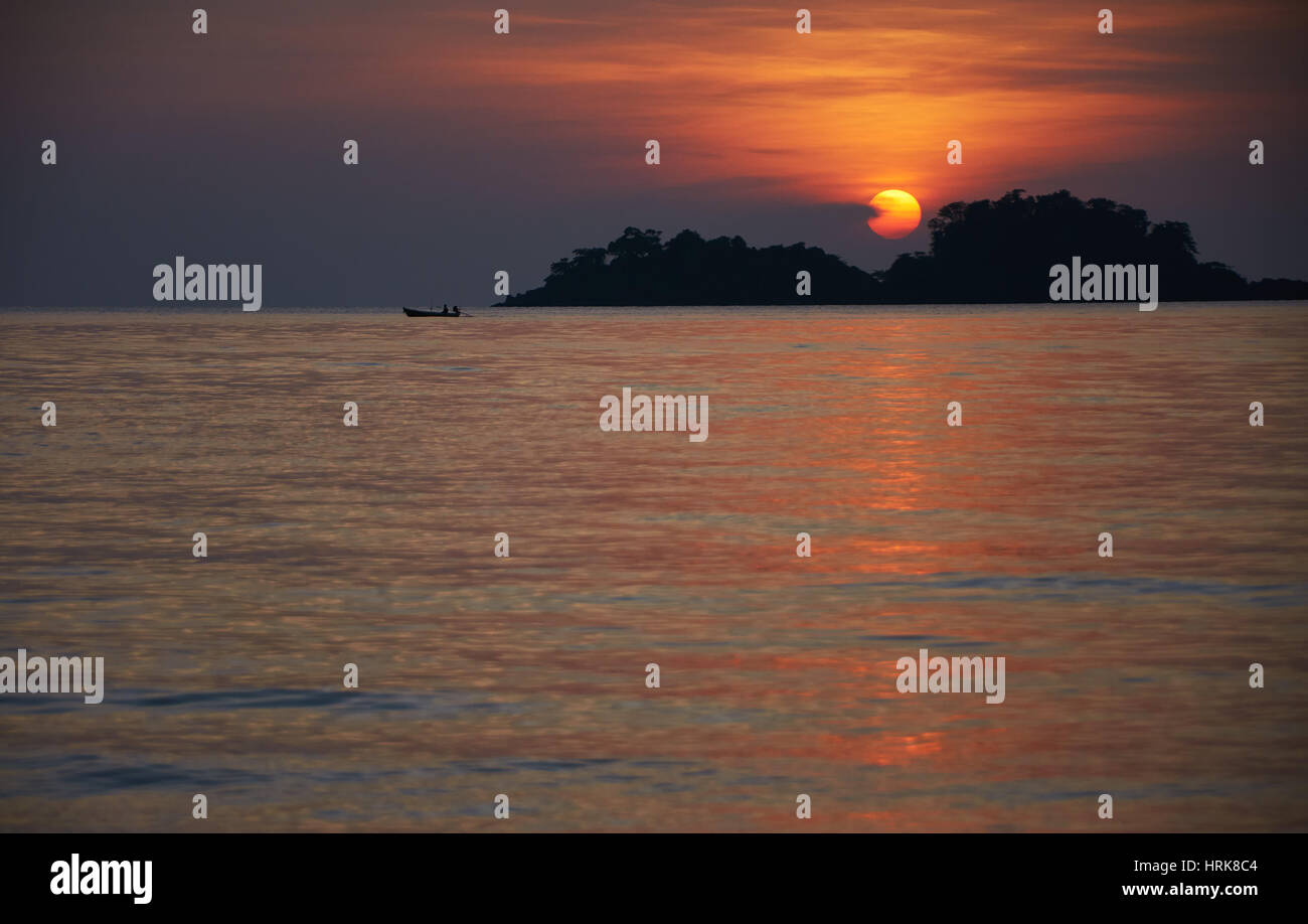 Silouette of fishing boat at sunset Stock Photo - Alamy
