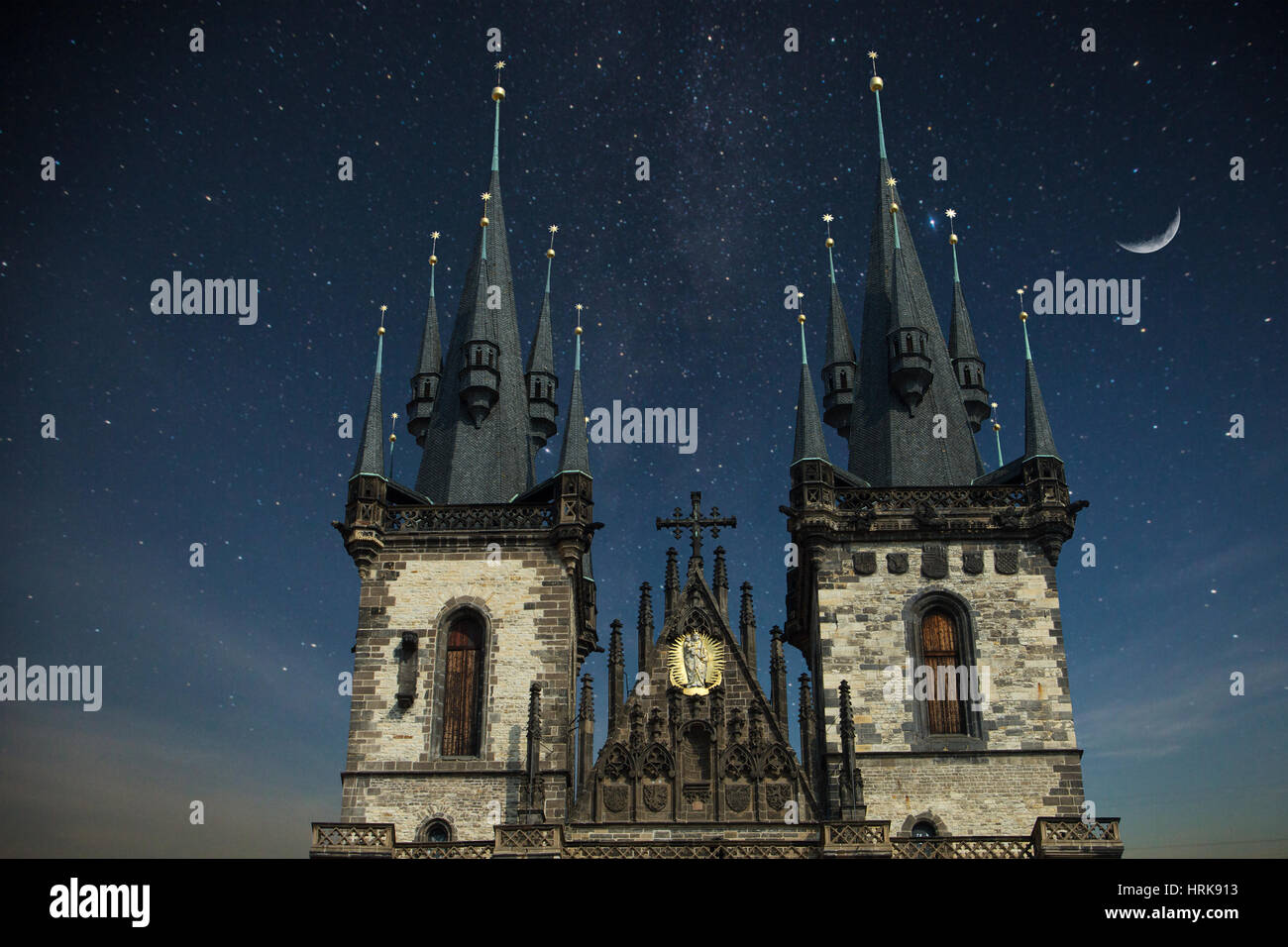 Prague Old town square, Tyn Cathedral. under sunlight. At night the stars shine and the moon. Stock Photo