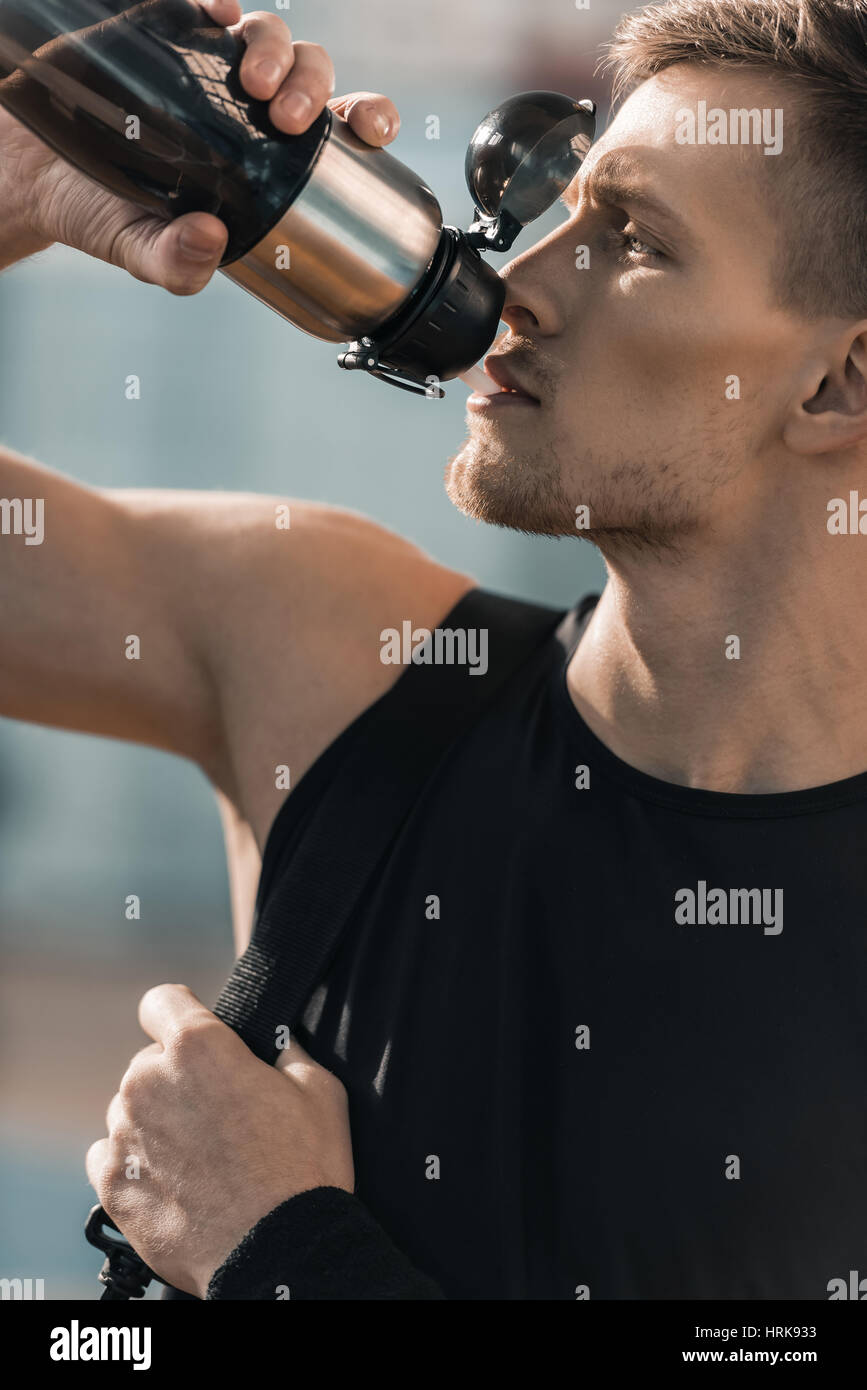 Sportsman drinking water from bottle hi-res stock photography and ...