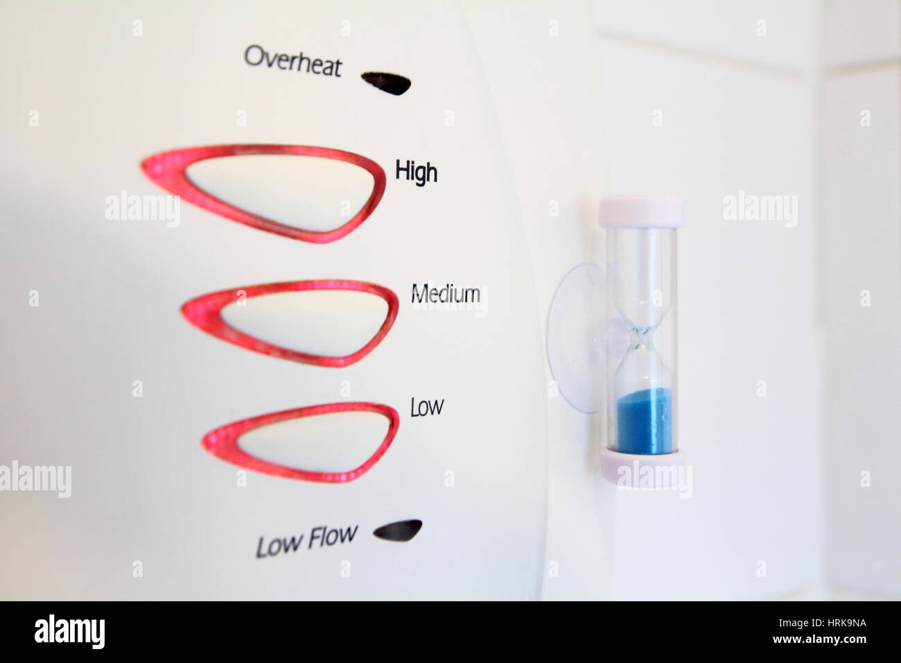 Egg timer attached to electric shower to reduce water and power usage