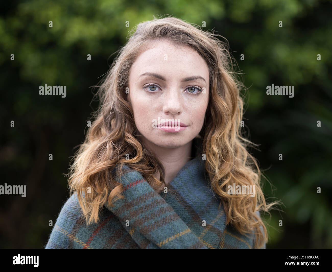 Young woman with Antique Hunting Stewart tartan shawl Stock Photo