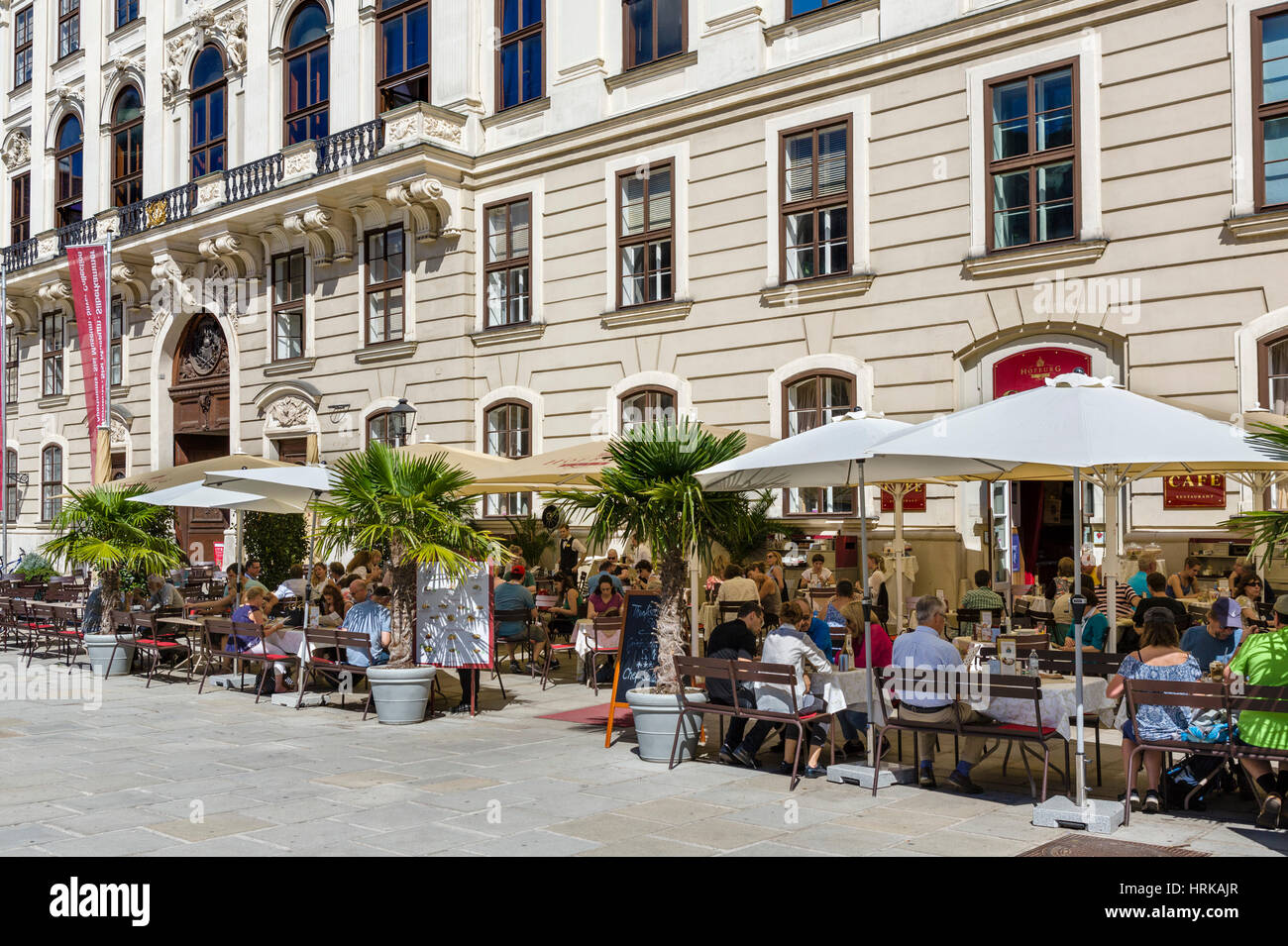 Cafe in front of the Reichskanzleitrakt (Imperial Chancellory Wing) in the Internal Castle Square, Hofburg Palace, Vienna, Austria Stock Photo