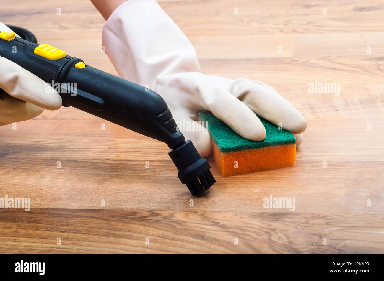 Wooden, parquet, laminate floors cleaning with steam in the room