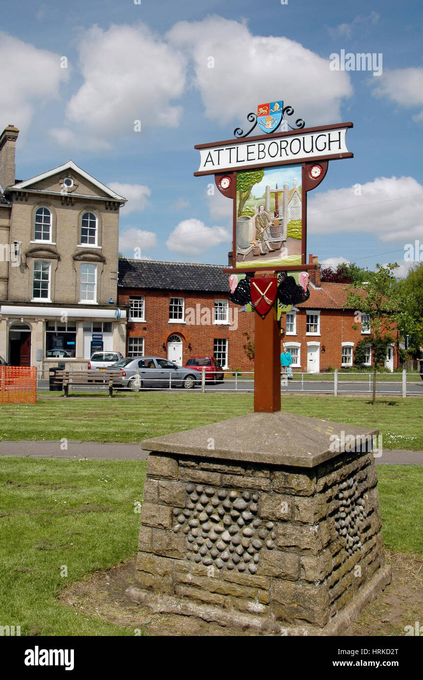 Attleborough town sign with historic cider press depiction on Queen's