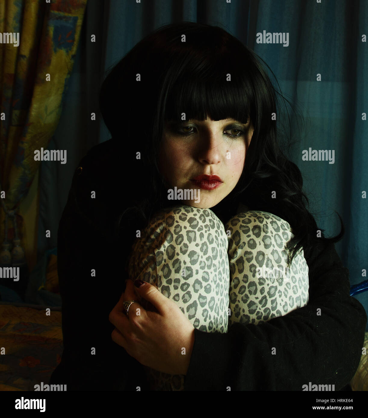 Sad young woman trapped in her bedroom Stock Photo