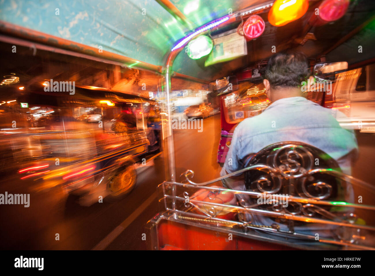 Brightly,lights,lit,colour,colourful,tuk-tuk,tuk,tuk,tuk tuk,auto,rickshaw,taxi,blur,motion,speed,movement,Bangkok,Thailand,Thai,Asia,Asian, Stock Photo