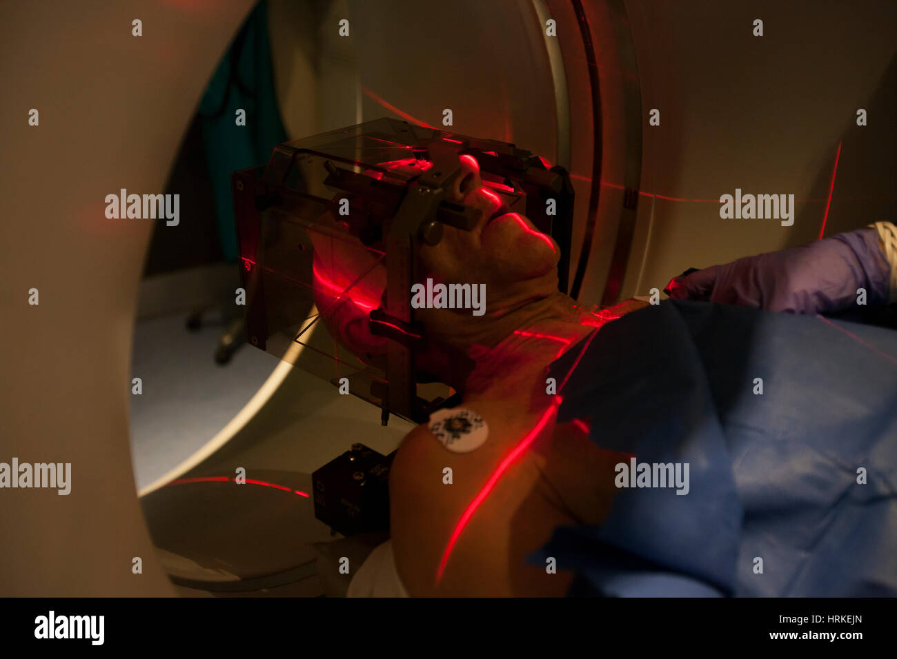 Patient lying inside a medical scanner in hospital. Stock Photo