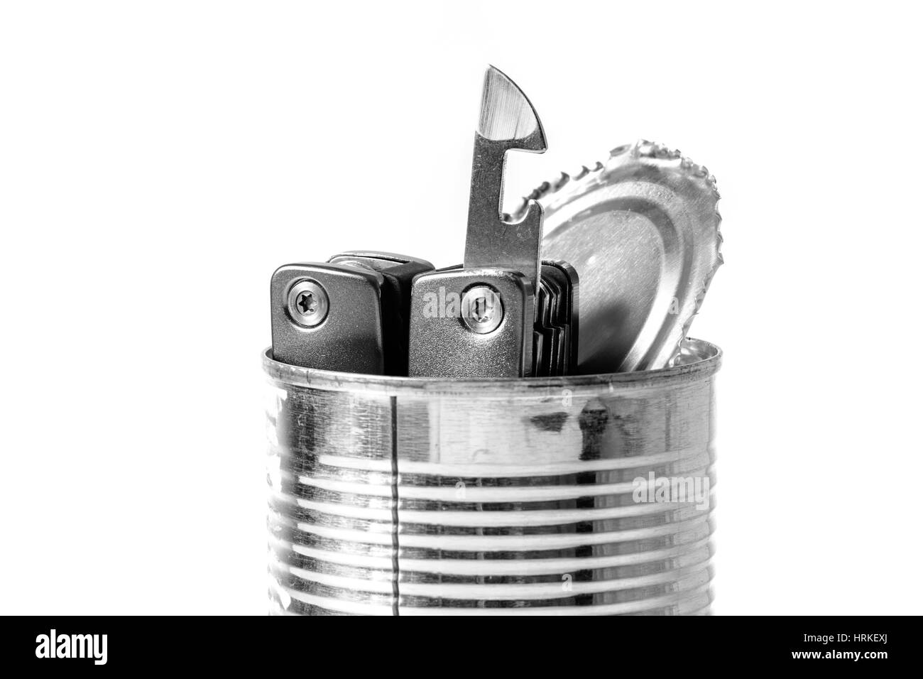 tin opener and opened tin, isolate object Stock Photo