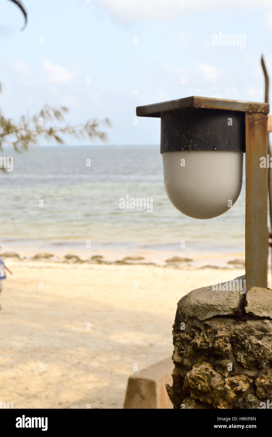 Decorative lamp in a park of Mombasa in Kenya with the beach and the