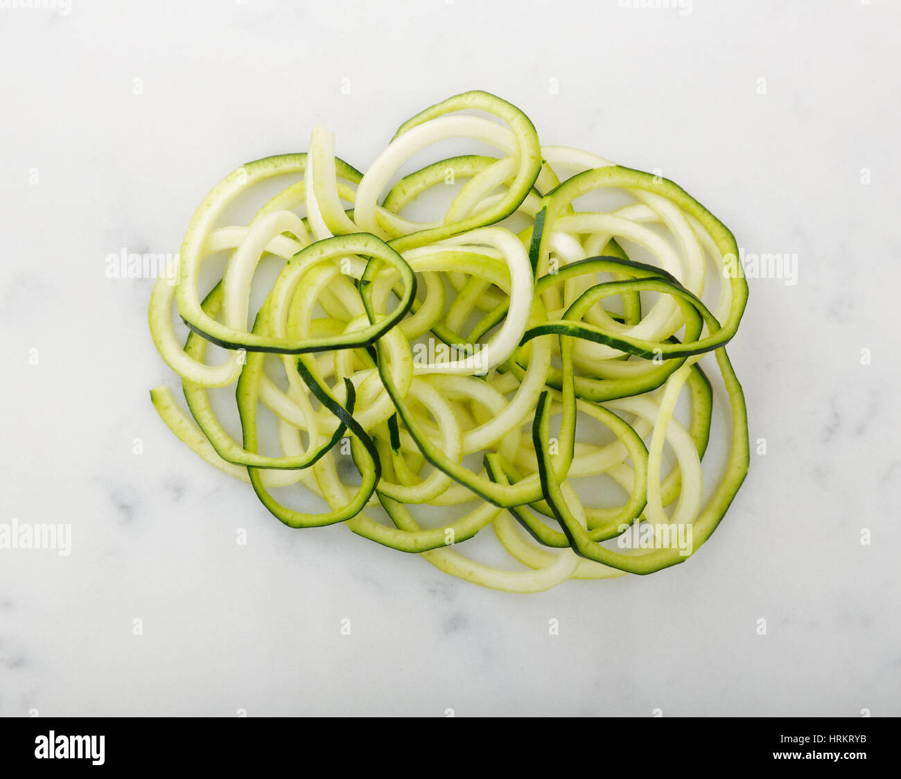 Zucchini noodles displayed on white Stock Photo