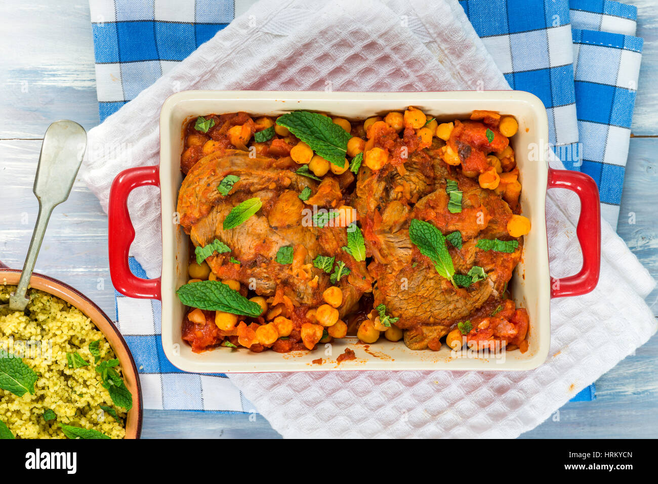 Harissa lamb chops with chickpeas and minted couscous top view Stock