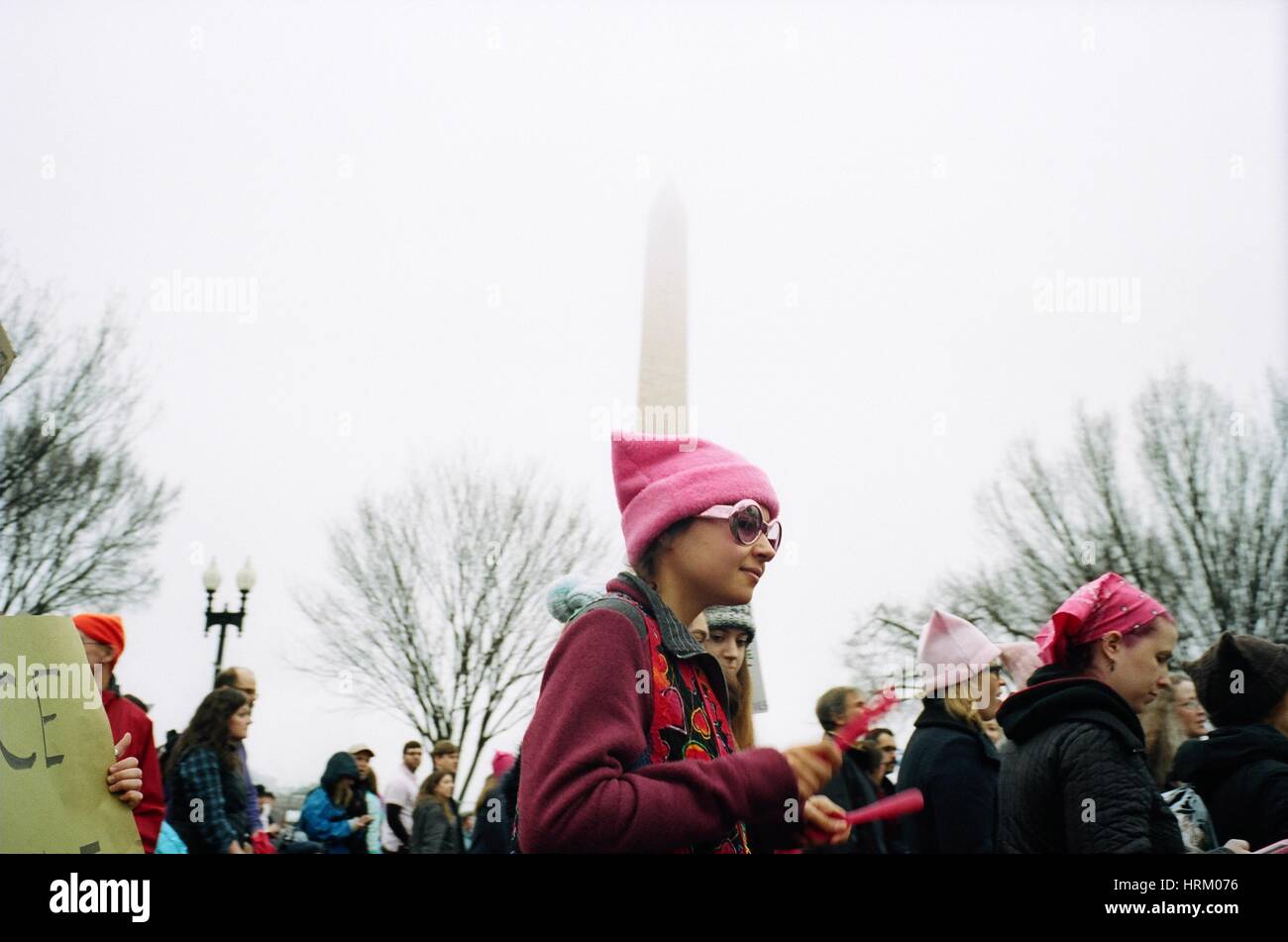 Girl in front of Washington Monument Scenes from the Women's March on Washington the day after Donald J. Trump's inauguration as the 45th President of the United States of America. (Photo by Jeremy Hogan) Stock Photo
