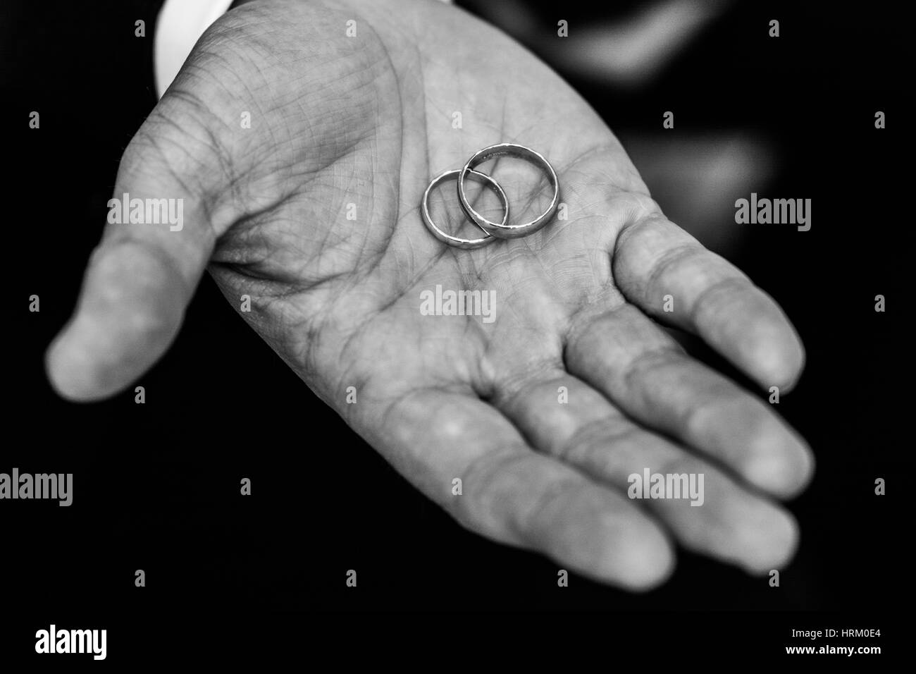 Hand holding wedding ring Black and White Stock Photos & Images Alamy
