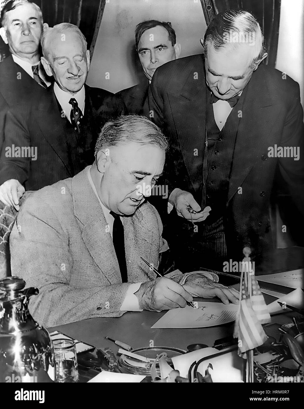 PRESIDENT FRANKLIN D. ROOSEVELT (1882-1945) in the Oval Office signing the American Declaration of War against Germany 11 December 1941 Stock Photo
