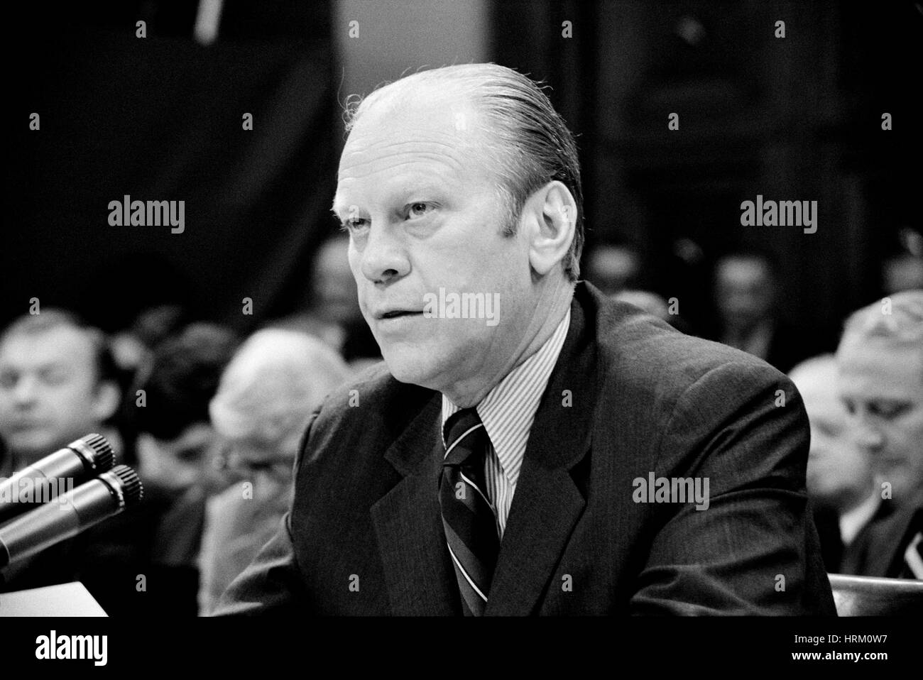 GERALD FORD (1913-2006) speaking at a House Judiciary hearing about his issue of a pardon to Richard Nixon on 17 October 1974. Photo: Thomas O'Halloran/Library of Congress Stock Photo