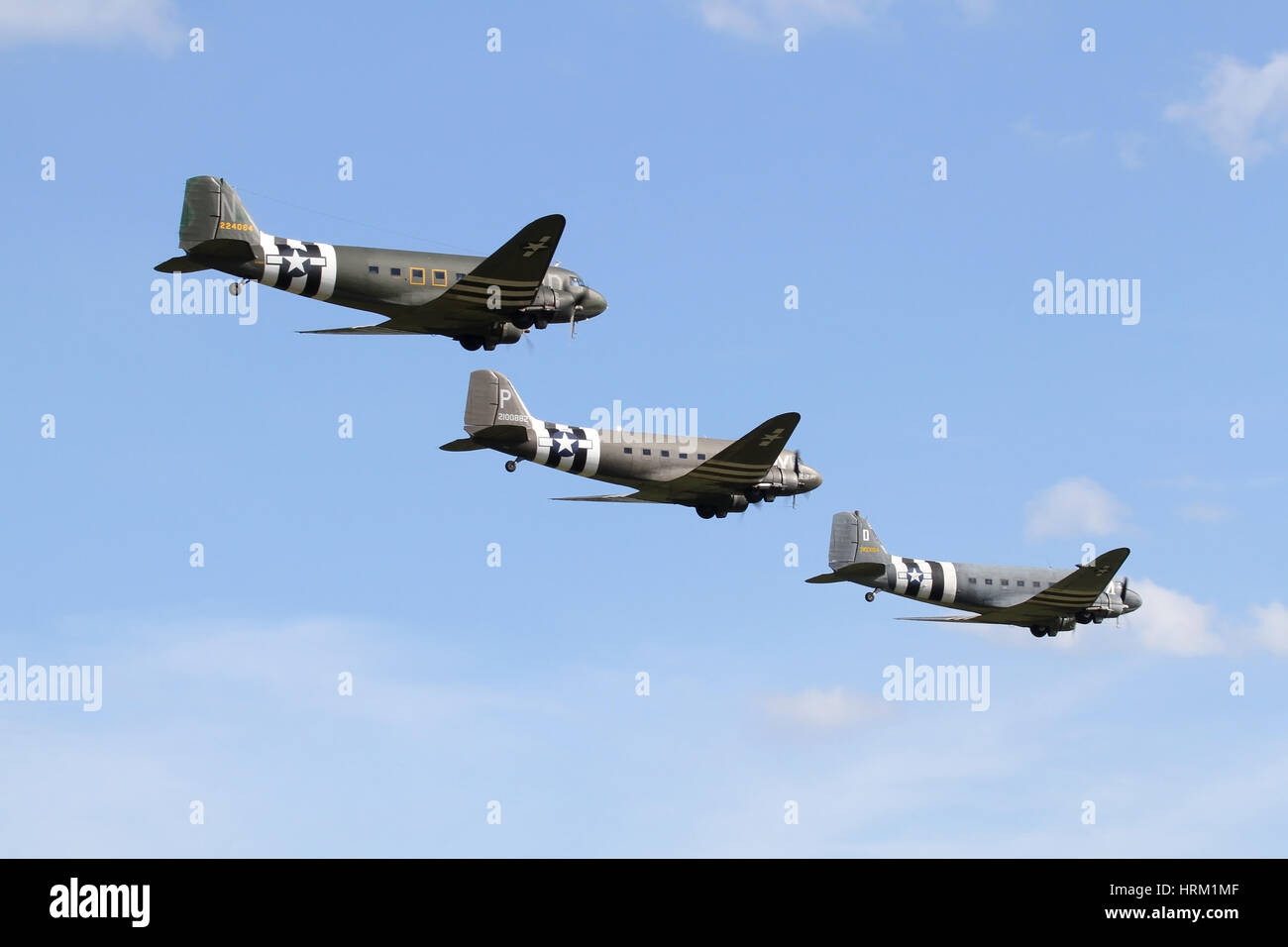 A formation of three Douglas DC-3/C-47s at the 70th anniversary of D-Day airshow hosted by Duxford in 2014. Stock Photo