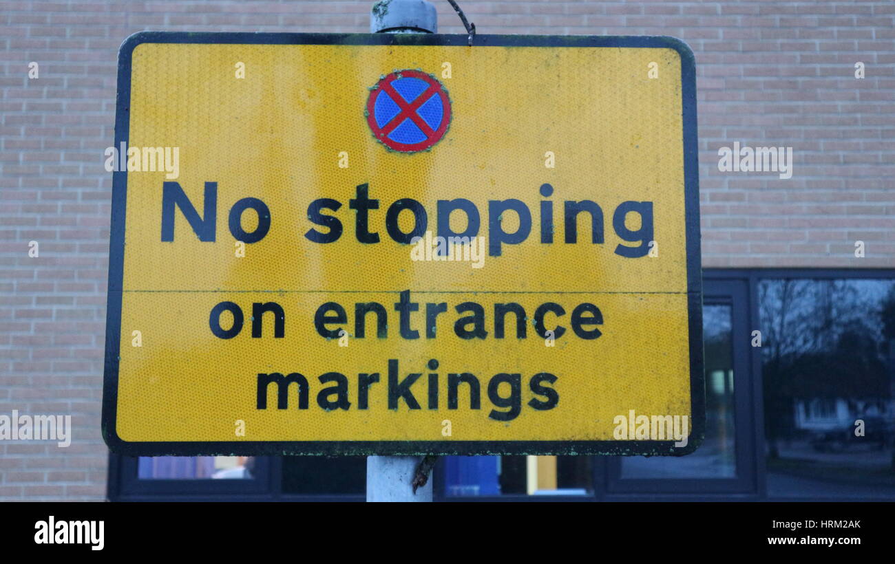 Street sign with no stopping on entrance markings, UK Stock Photo