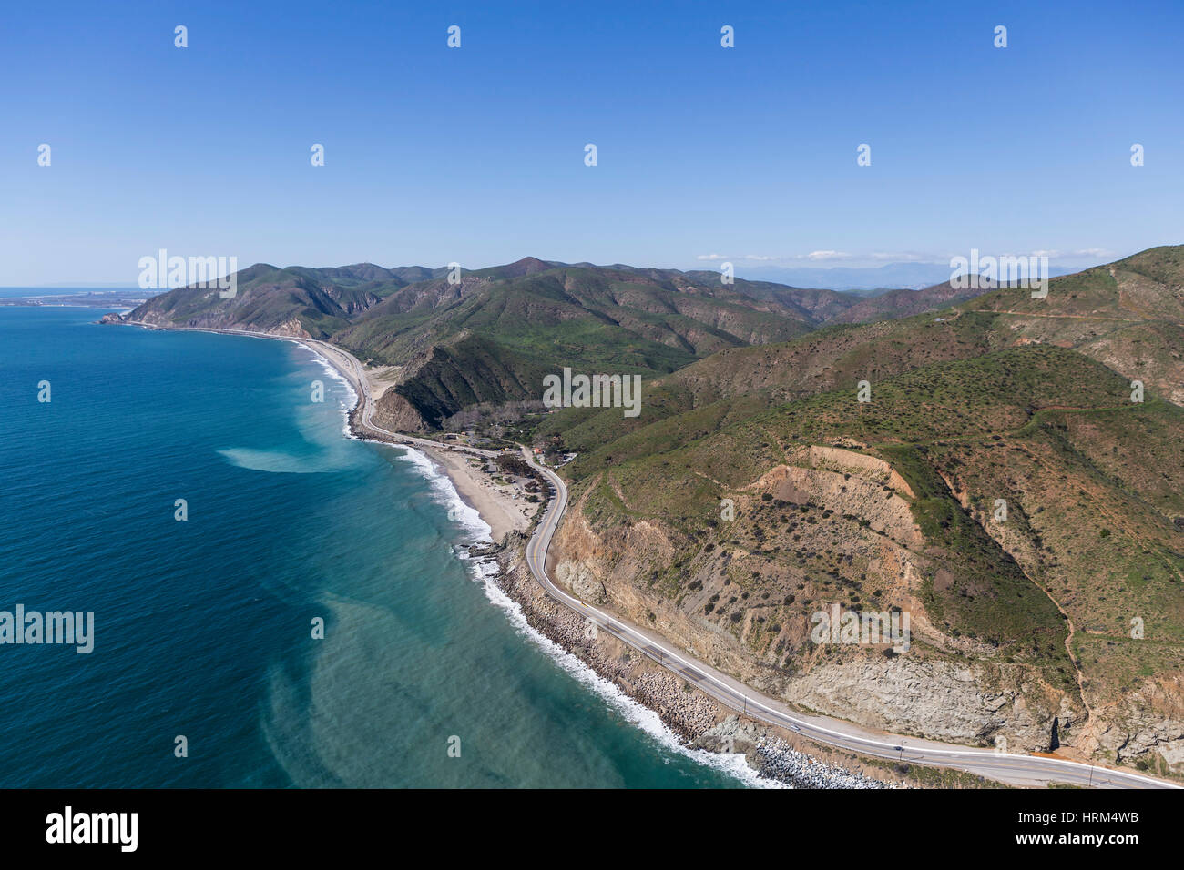 Aerial of Pacific Coast Highway winding past Sycamore Cove State Park north of Malibu in Southern California. Stock Photo