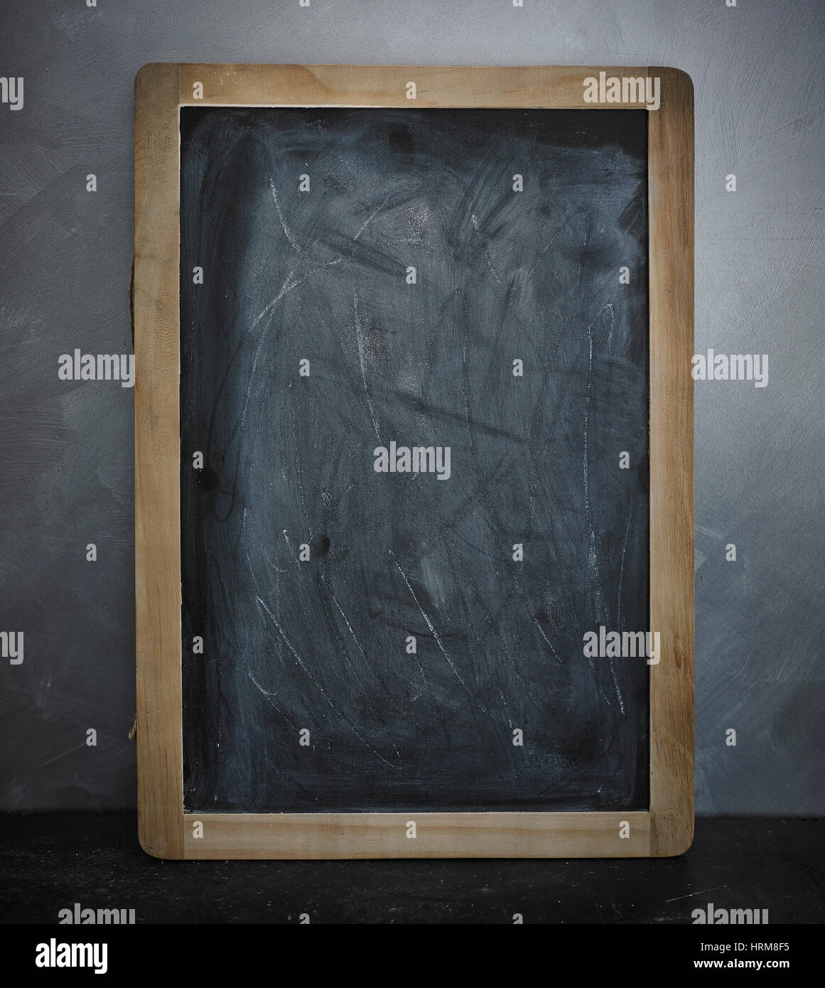 slate blackboard leaning against wall Stock Photo Alamy