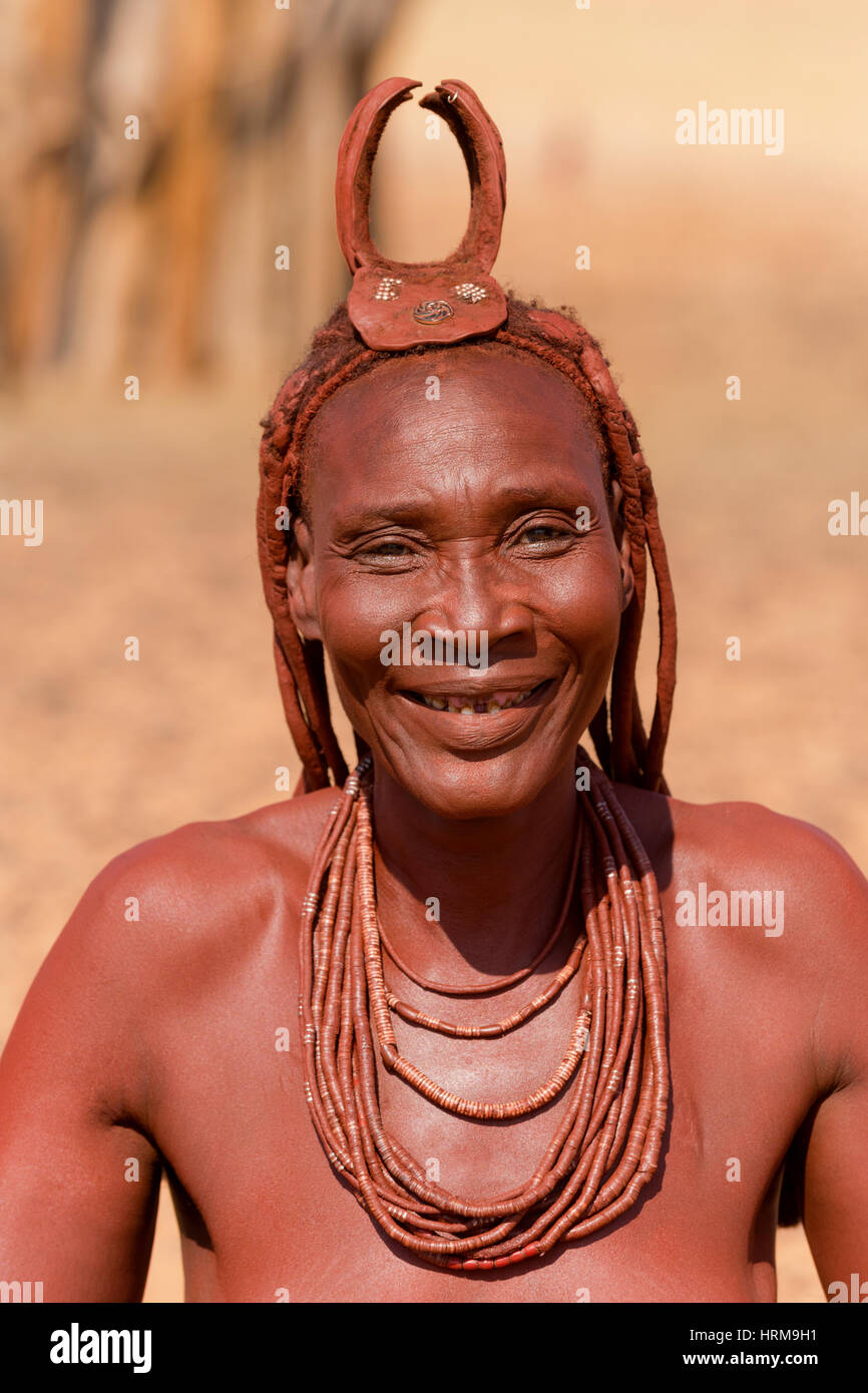 Himba mother portrait, taken close to The Kunene River, Kaokoland, Namibia. Stock Photo