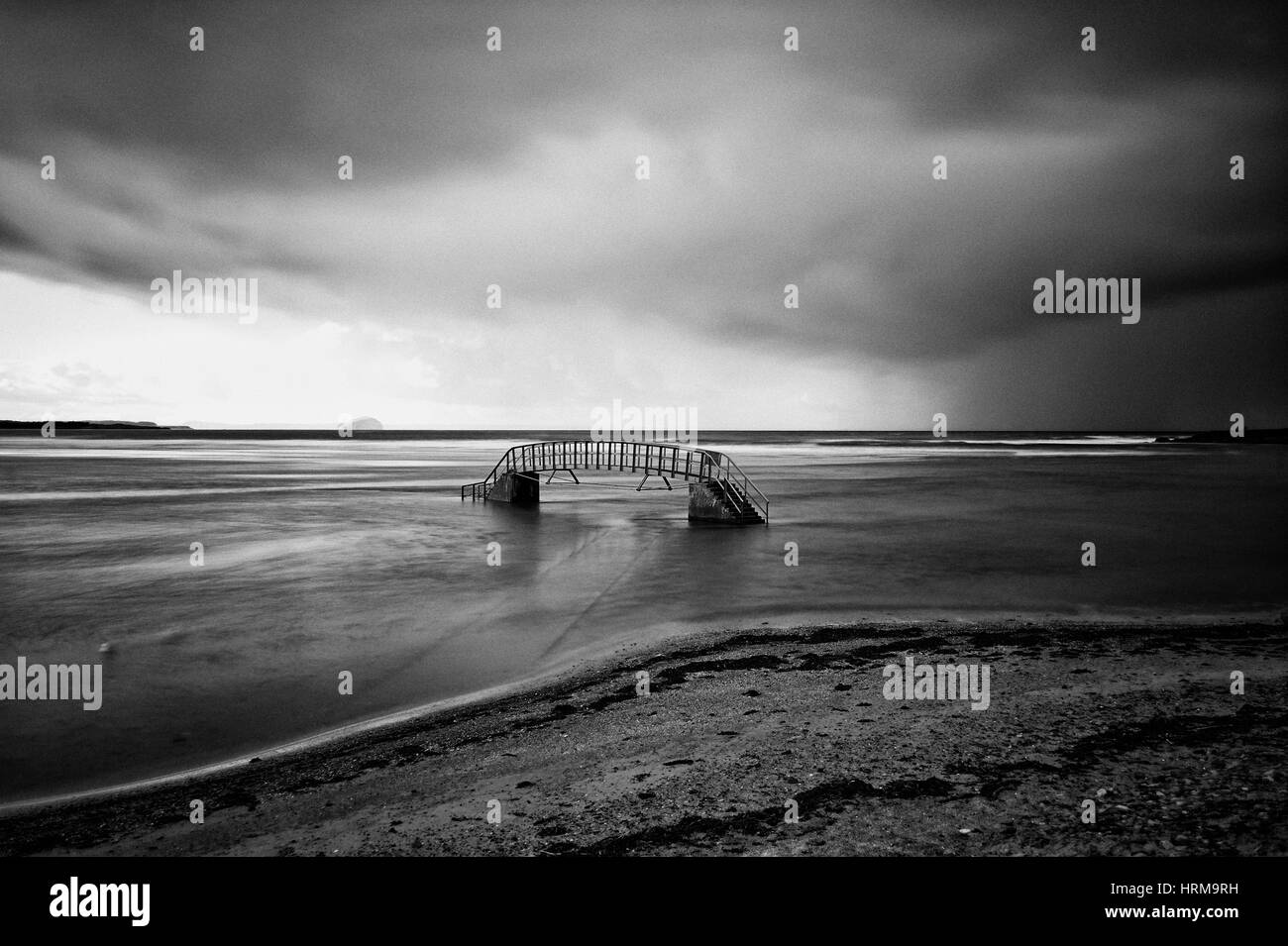 ,The Bridge to Nowhere, Belhaven Bay, Scotland B&W Stock Photo
