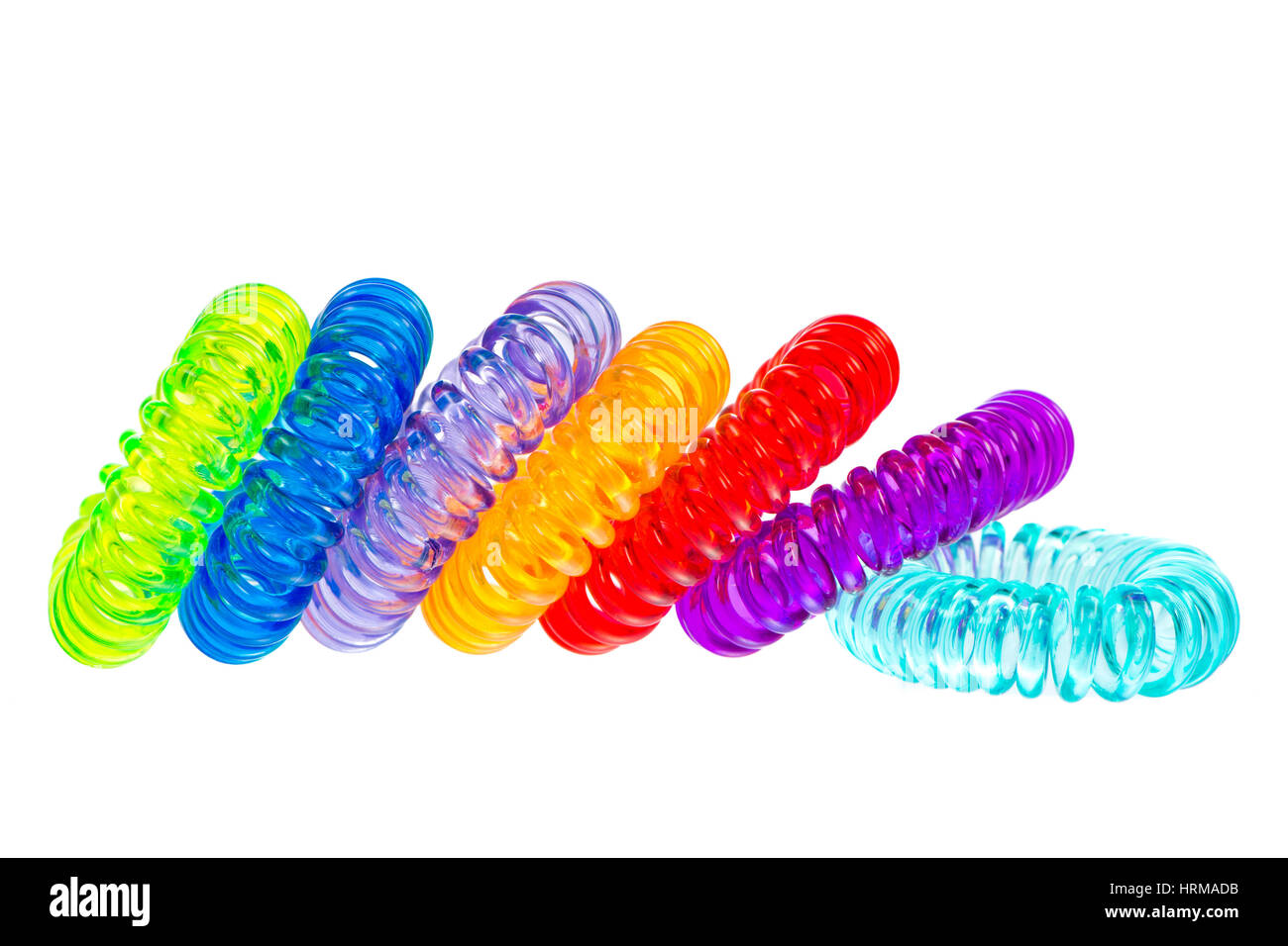Closeup of various isolated spiral hair ties Stock Photo