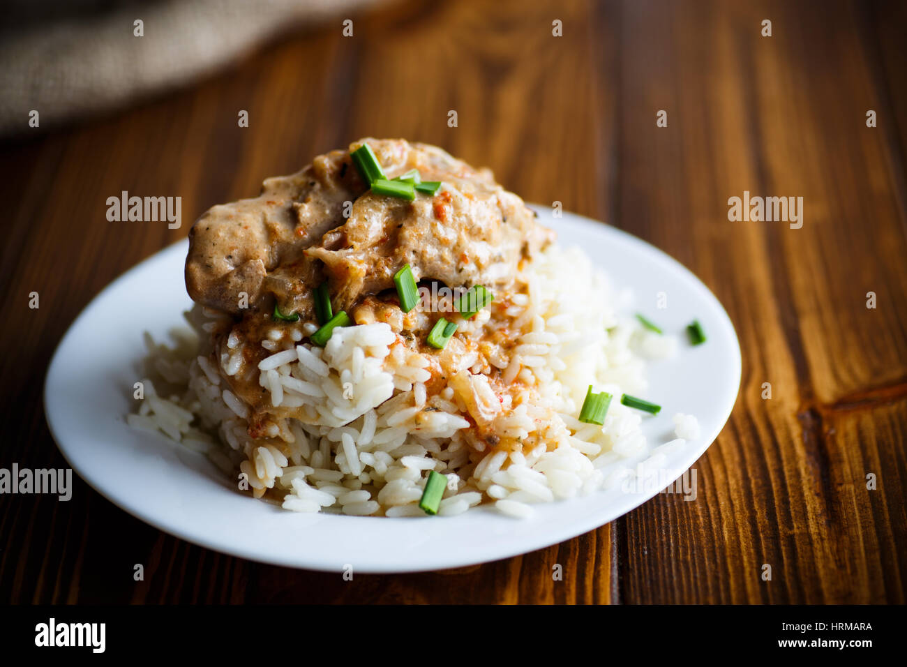 Boiled rice with rabbit meat and sauce Stock Photo - Alamy