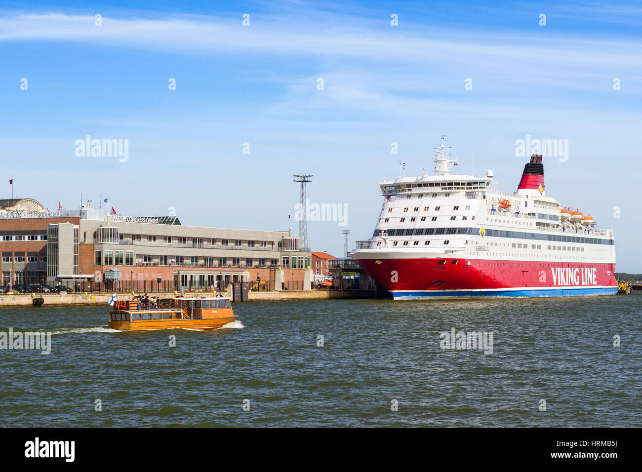 Helsinki, Finland - August 4, 2012: Cargo-passenger cruise ferry Viking Line moored in Bay at pier in Helsinki port. Passengers boarding from terminal Stock Photo