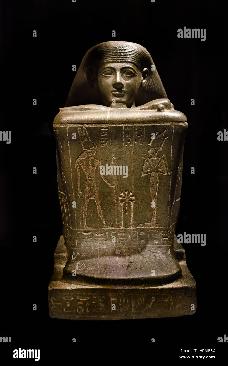 The cube figure of Amun priest Hor comes from Karnak and was created around 775 BC (23rd dynasty). (block statue of Amun priest Hor) pharaoh with the crown of Upper and Lower Egypt is depicted, as well as the phantom-headed god Horus, who revenged the murder of his father Osiris and became a heir to the throne. Stock Photo