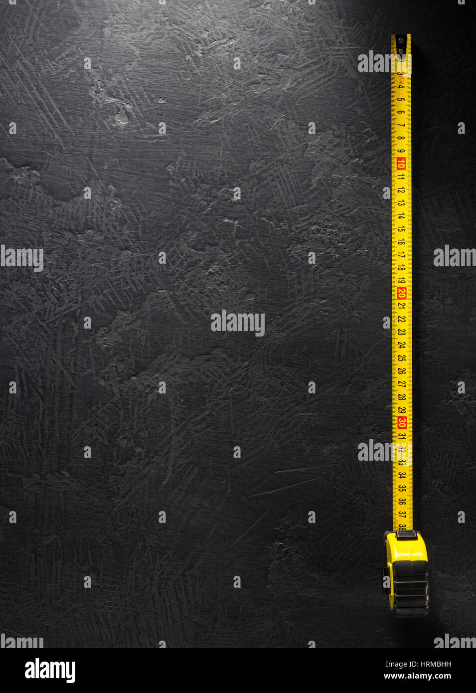 tape measure on black background texture Stock Photo - Alamy