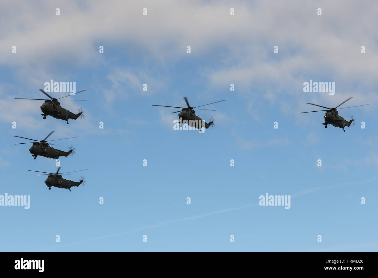 Royal Navy Westland Sea King HC.4 flyover Portsmouth Harbour for the last time before the type was retired in March 2016 Stock Photo