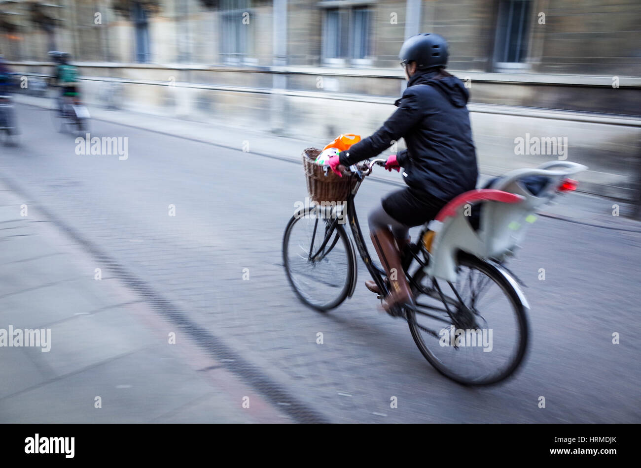 Motion Blur - Commuters cycle through central Cambridge Stock Photo