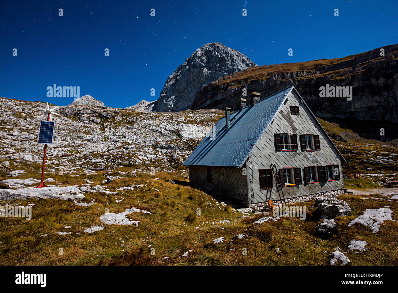 Mountain hut at night.Mountin peak Mangart in Slovenia. Stock Photo