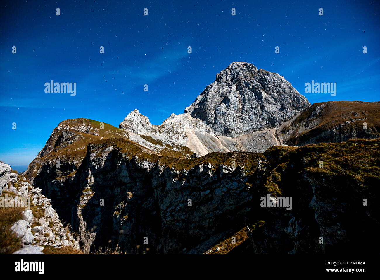 Mountain peak Mangart in the night with starry night, Slovenia Julian alps. Stock Photo