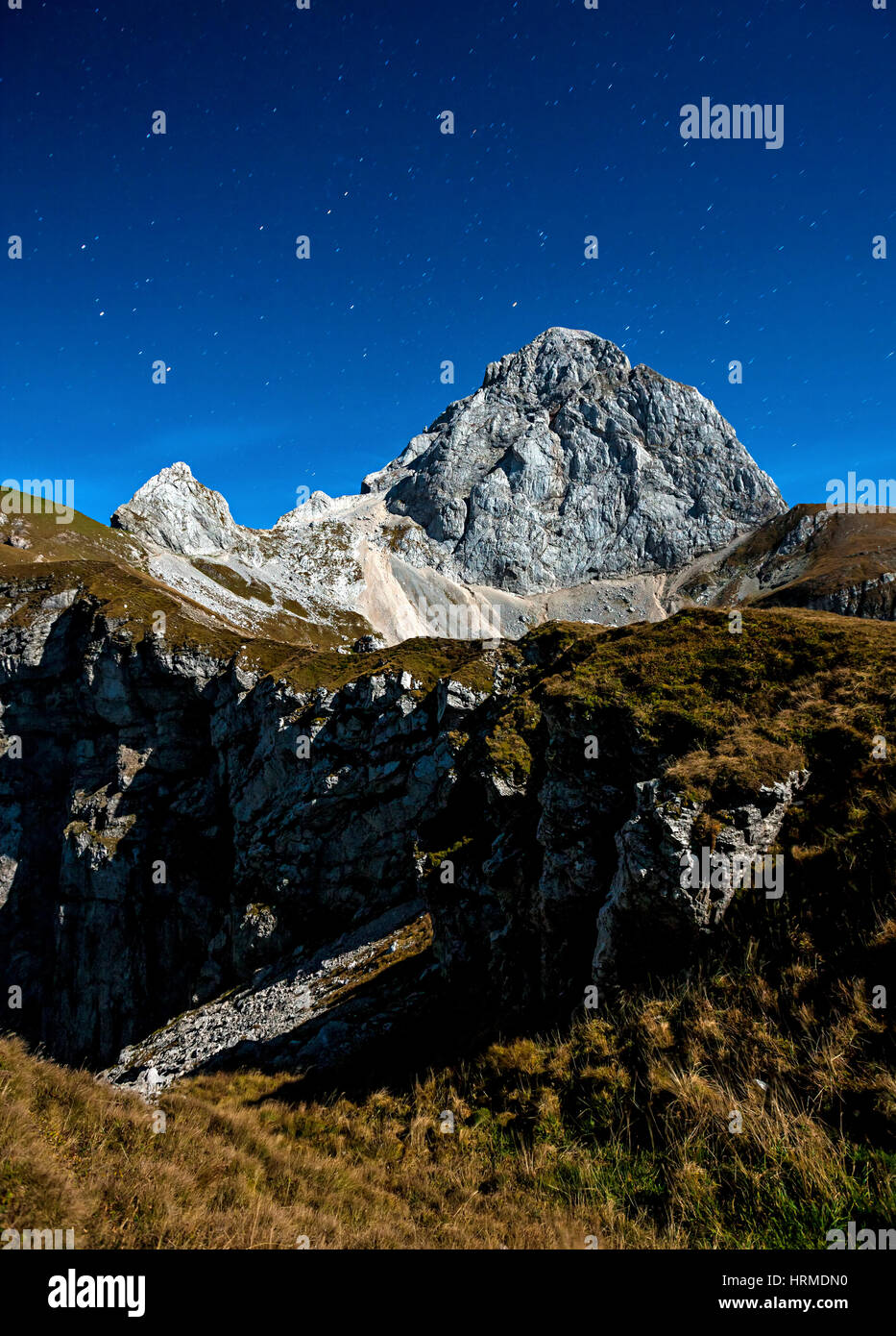 Mountain peak Mangart in the night with starry night, Slovenia Julian alps. Stock Photo