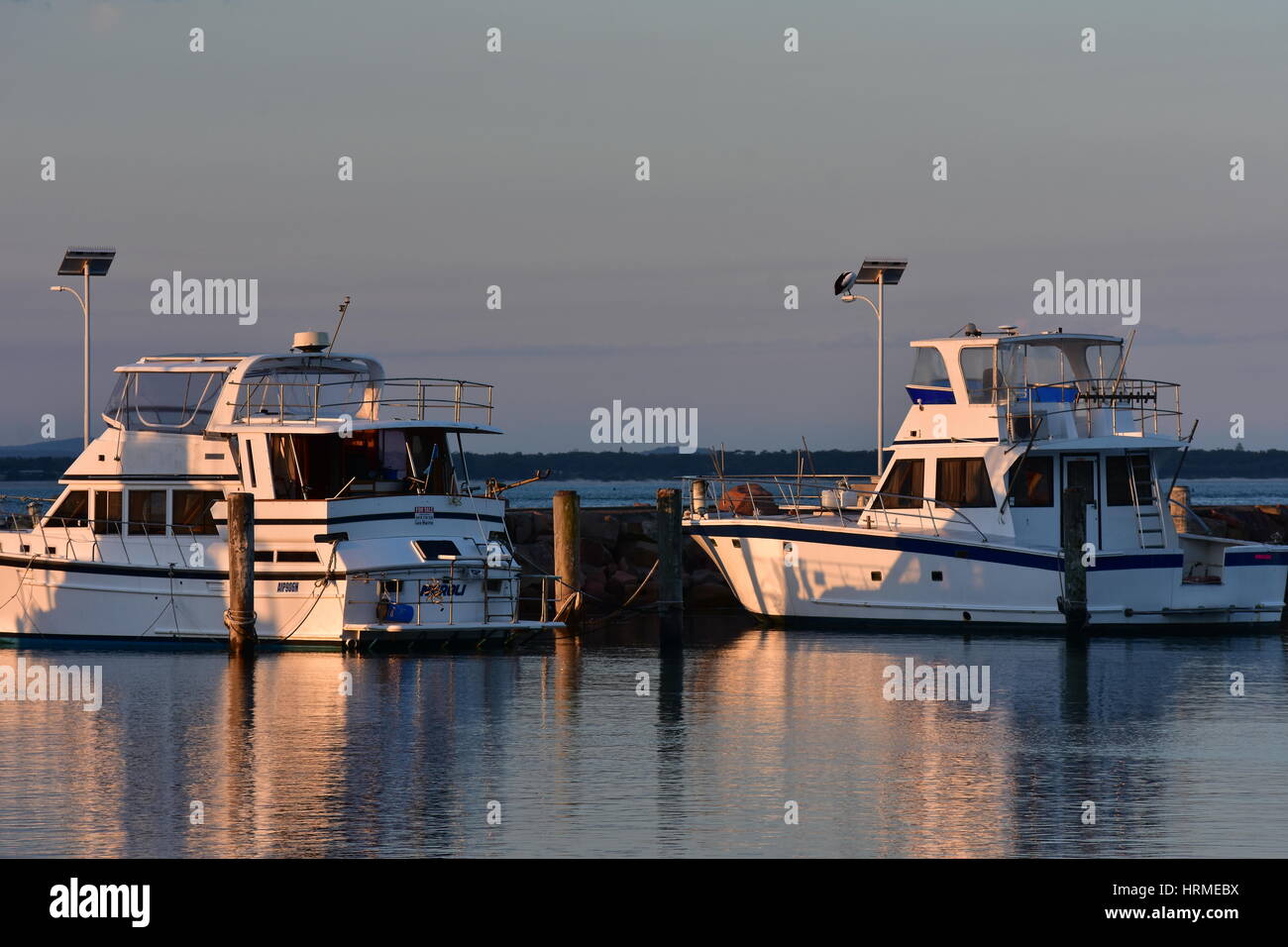 Recreational and commercial vessels berthed in marina in Nelson Bay. Stock Photo