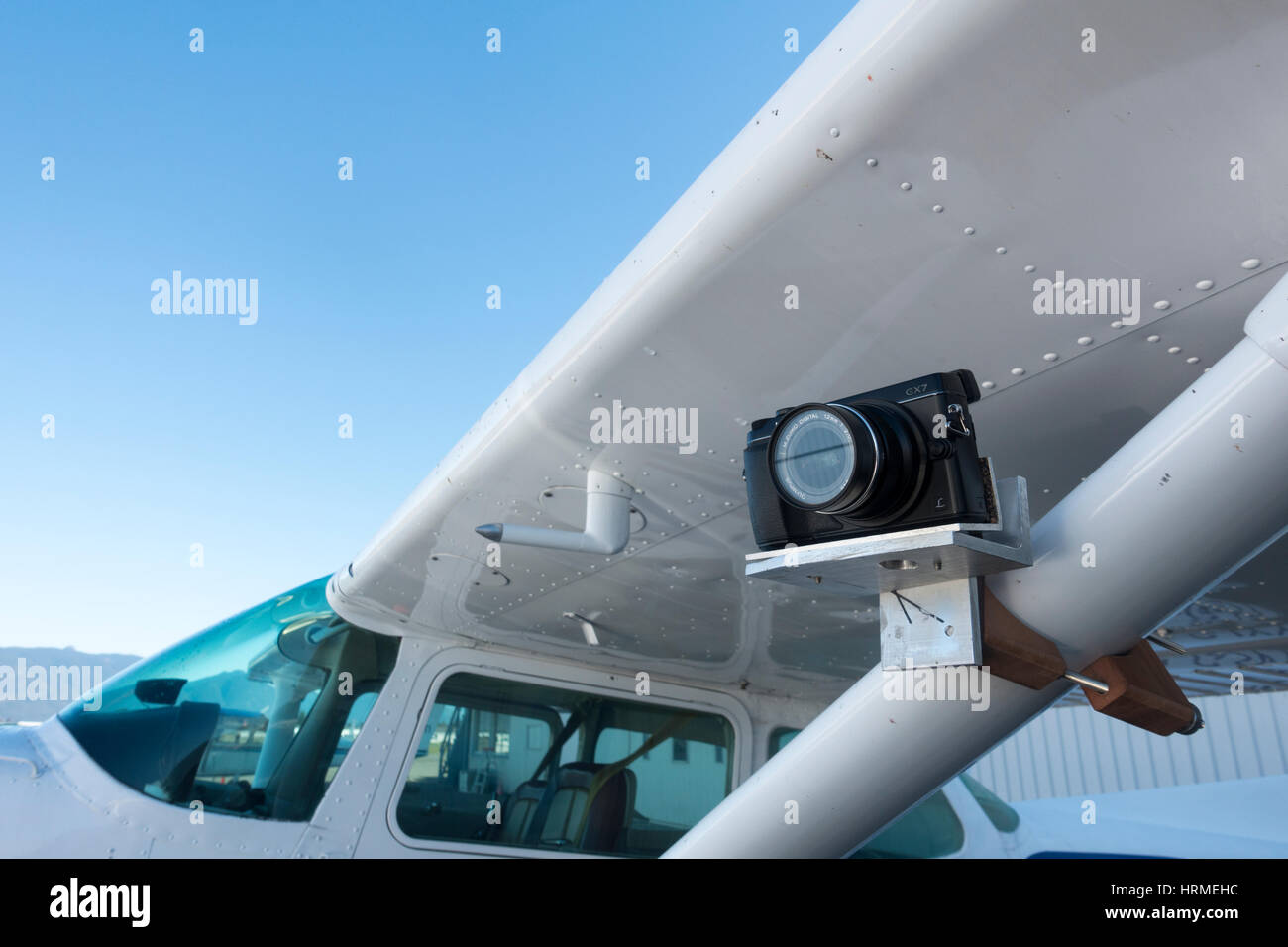 Camera mounted on strut of plane Stock Photo
