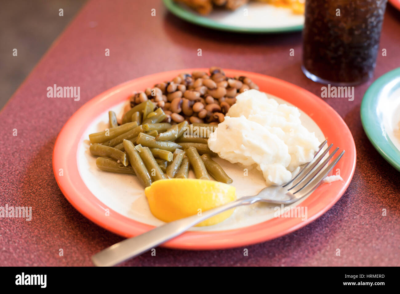 Lemon slice, green beans, black eyed peas and mashed potatoes Stock