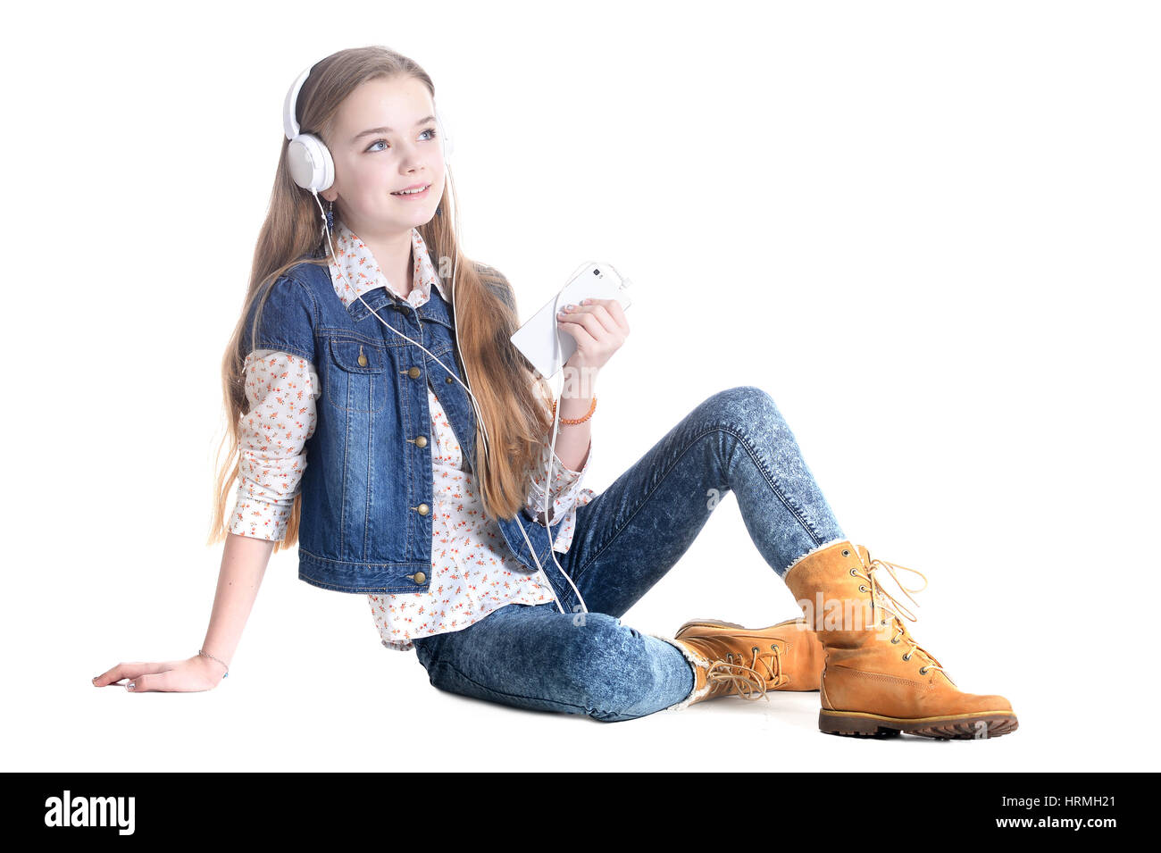 Portrait of a teen girl with phone and headphones Stock Photo - Alamy