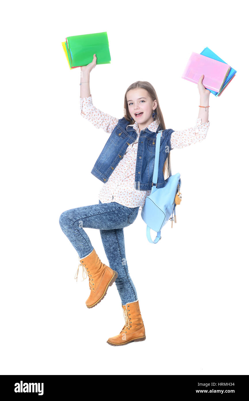 Girl teenager stands with books on a white background Stock Photo - Alamy