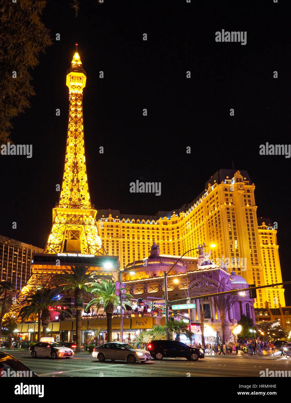 Neon signs and the illuminated Eiffel tower at 'Paris Las Vegas'  hotel and casino, landmark of the Las Vegas night life. Stock Photo