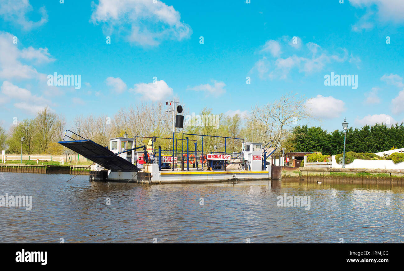 Reedham ferry, vehicular chain ferry across the River Yare on the Norfolk Broads during a bright hot sunny day Stock Photo