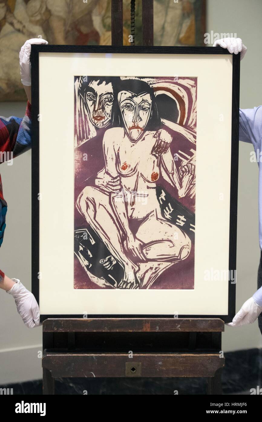 Members of staff adjust 'The Melancholic Girl' by Ernst Ludwig Kirchner, 1928, during a press call in London ahead of the Victoria and Albert Museum's Major autumn exhibition: Opera: Passion, Power and Politics. Stock Photo